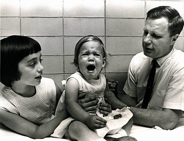 Jeryl Lynn watching her sister, Kirsten Jeanne Hilleman, receive the mumps vaccination from Dr. Robert E. Weibel in 1968